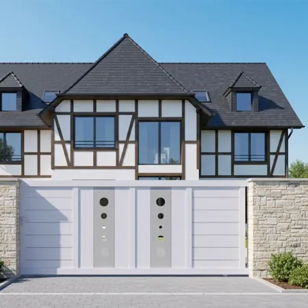 Devant une maison Alsacienne notre Portail Coulissant en Aluminium Mil Blanc
