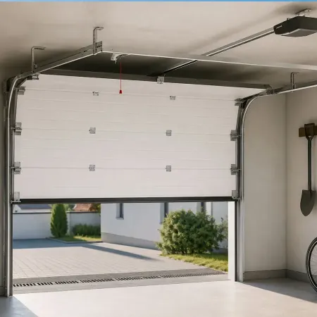 Porte de garage sectionnelle motorisée installée à l’intérieur d’un garage avec rails au plafond et ouverture partielle