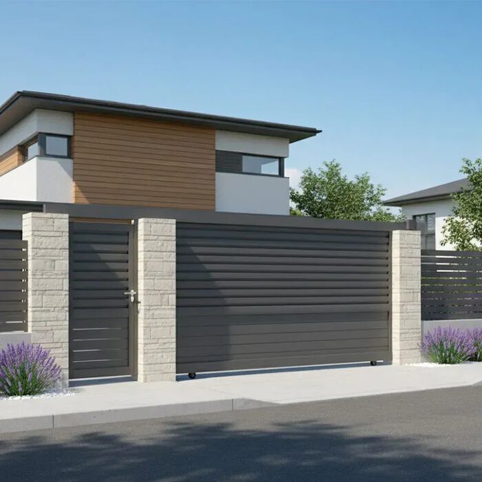 Portail coulissant DAD gris anthracite devant une maison moderne