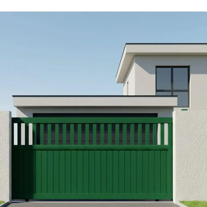 Portail coulissant DEL vert devant une maison moderne