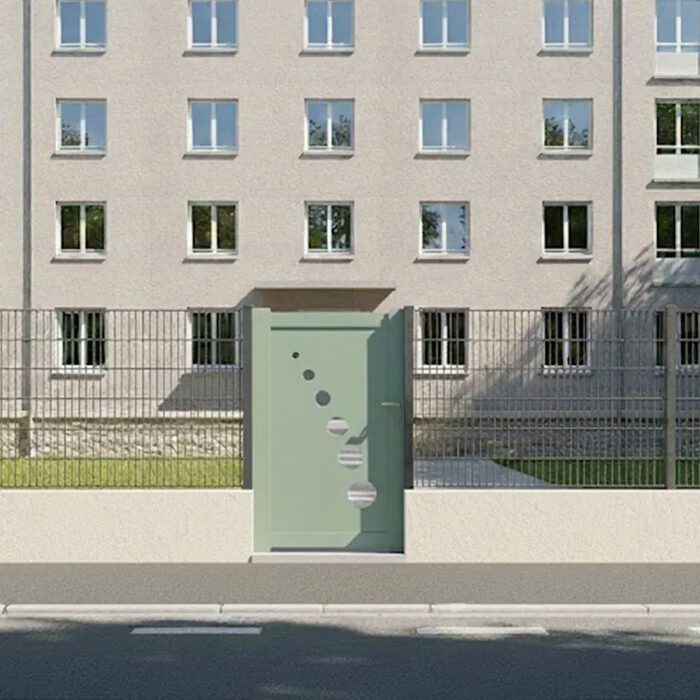 Portillon aluminium TRAI vert amande devant un immeuble